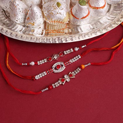 Silver Rakhis with Flavorful Sweets