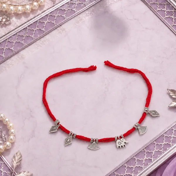 Elegant Red Cotton Rakhi with Dangling Silver Charms