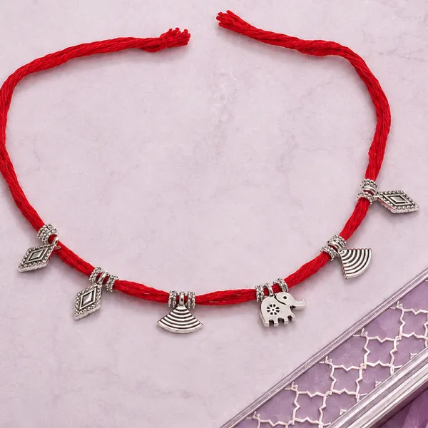 Elegant Red Cotton Rakhi with Dangling Silver Charms