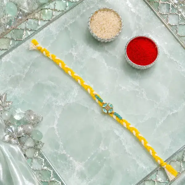 Elegant Yellow Thread Floral Design Rakhi with Roli Chawal