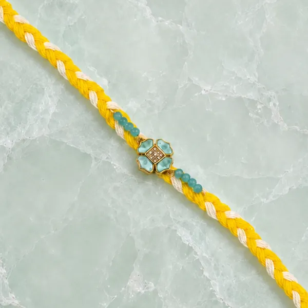 Elegant Yellow Thread Floral Design Rakhi with Roli Chawal