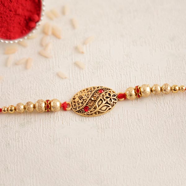 Antique Golden Rakhi with Pearls