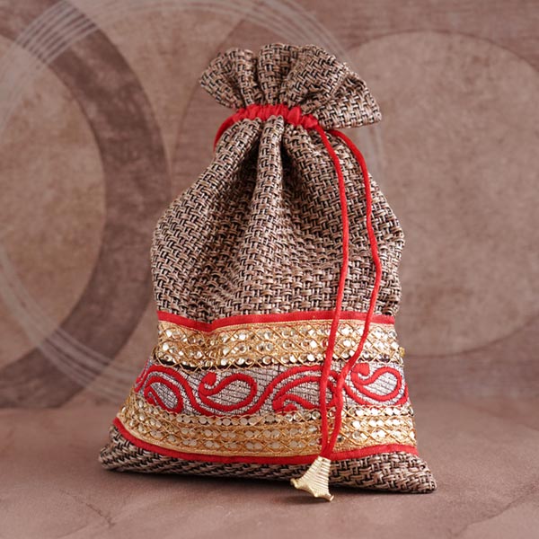 Two Stone Rakhi Set with Raisin Potli