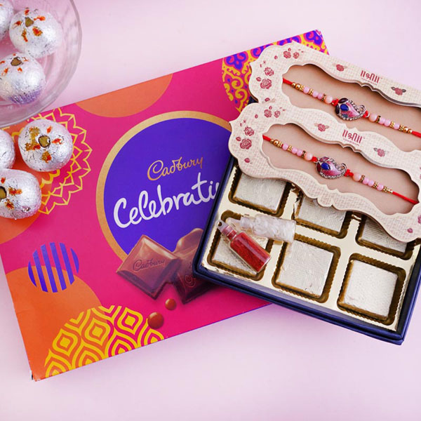 Two designer Rakhis with Chocolates and Sweets