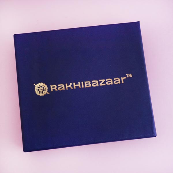 Two designer Rakhis with Chocolates and Sweets