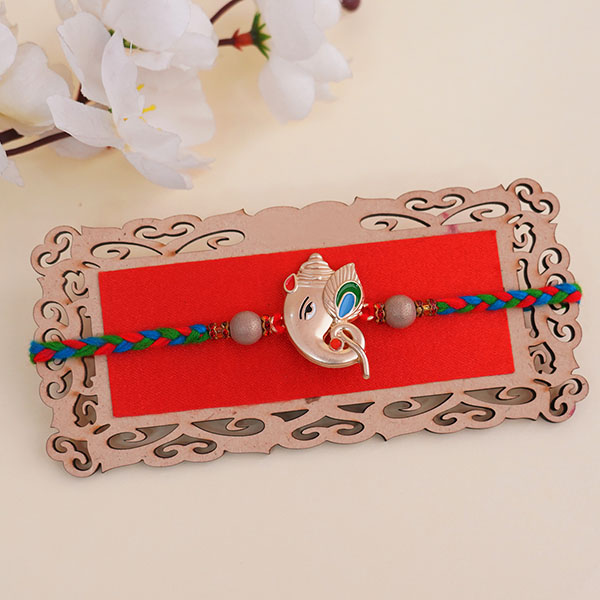 Golden Ganesha Rakhi with Assorted Chocolates
