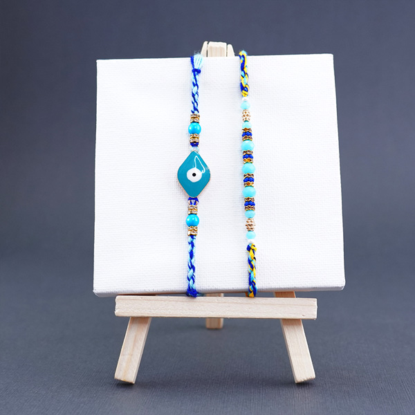 2 Evil Eye Rakhis with Chocolates