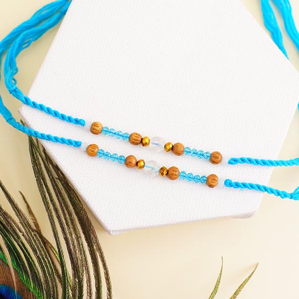 Four Designer Rakhis with Kaju Katli Sweets