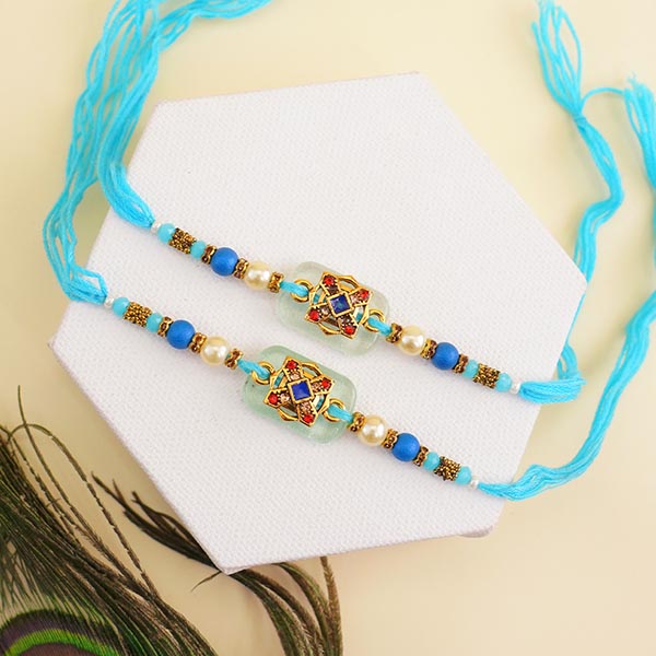 Four Designer Rakhis with Kaju Katli Sweets