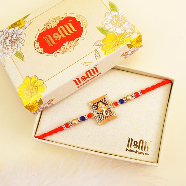 Golden Ganesha Rakhi with Haldirams Doda Barfi