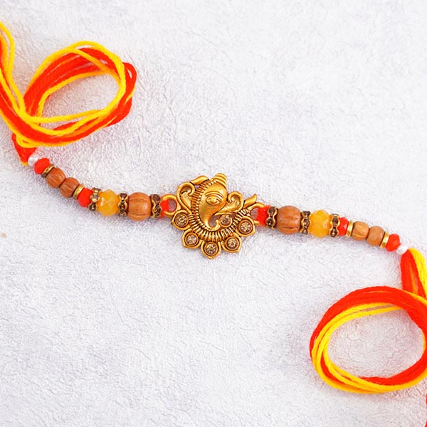 Dazzling Golden Rakhi with Sweets