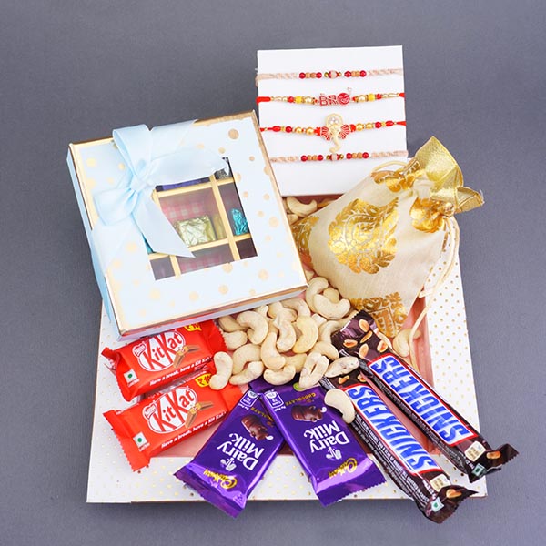 Four Attractive Rakhis with Dry Fruits N Chocolates Gift Pack