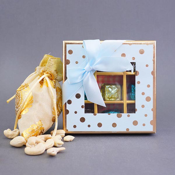 Four Attractive Rakhis with Dry Fruits N Chocolates Gift Pack