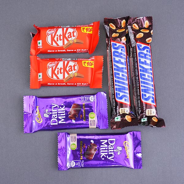 Four Attractive Rakhis with Dry Fruits N Chocolates Gift Pack