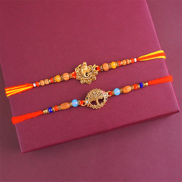 Two Golden Rakhis with Sweets N Book