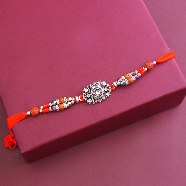 One Antique Rakhi with Sweets N Book Gift Hamper