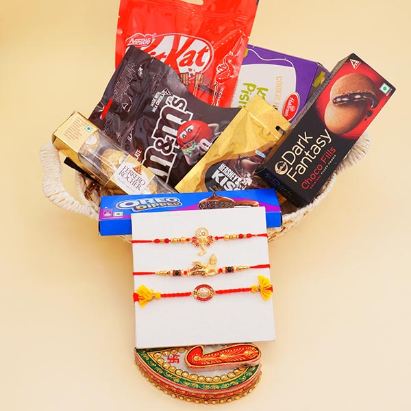 Three Golden Rakhis with Chocolates Gift Hamper