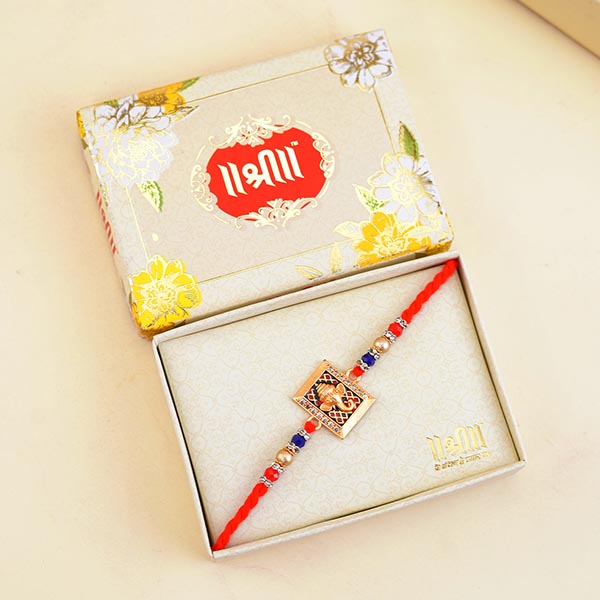 Golden Ganesha Rakhi with 4 Dairy Milk Chocolates