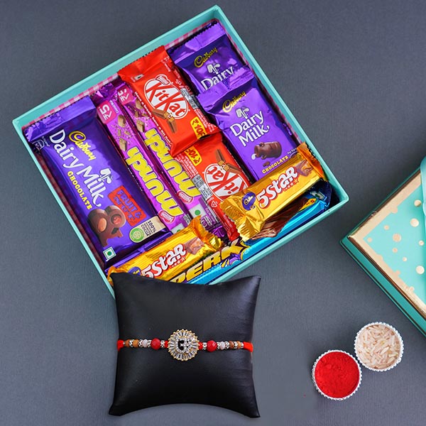 Silver Om Rakhi N Chocolates in a Designer Box