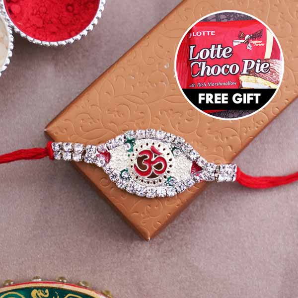 Silver Om rakhi with 1 Lotte Choco Pie