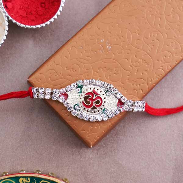 Silver Om rakhi with 1 Lotte Choco Pie