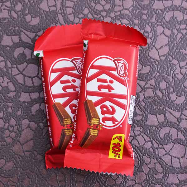 Golden Om Rakhi with 2 Kitkat