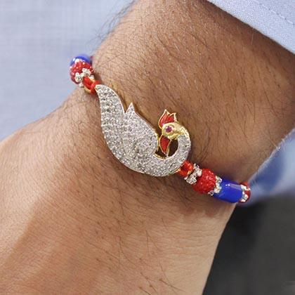 Sparkling AD Peacock Rakhi Hamper