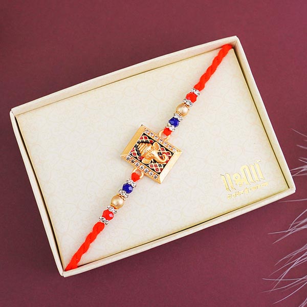 Auspicious Golden Ganpati Rakhi with Sweets Next Day Delivery