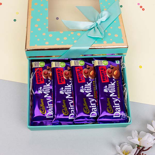 Designer Rakhi with a Combo of Dairy Milk Chocolate