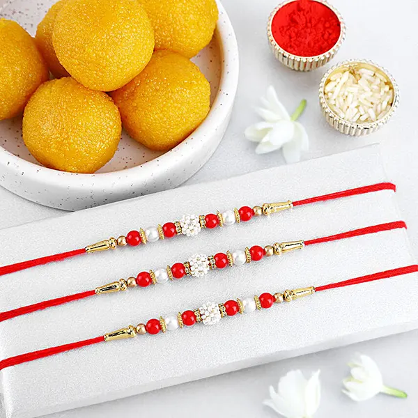 Timeless Pearl Rakhi Set of 3 N Laddoo Combo