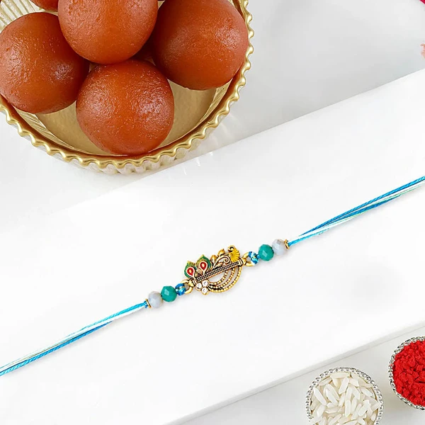 Divine Krishna Flute Rakhi with Gulab Jamun