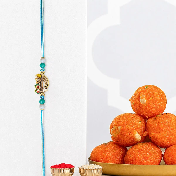 Divine Krishna Flute Rakhi with Motichoor Laddoo