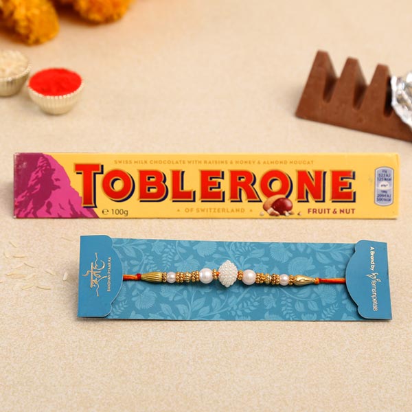 Elegant Pearl Mauli Rakhi And Toblerone Chocolate