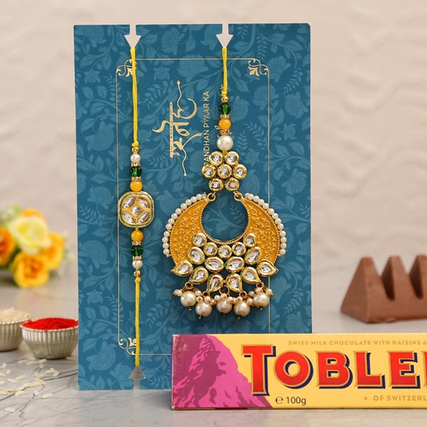 Yellow Crescent Shaped Lumba Rakhi Set With Toblerone Chocolate