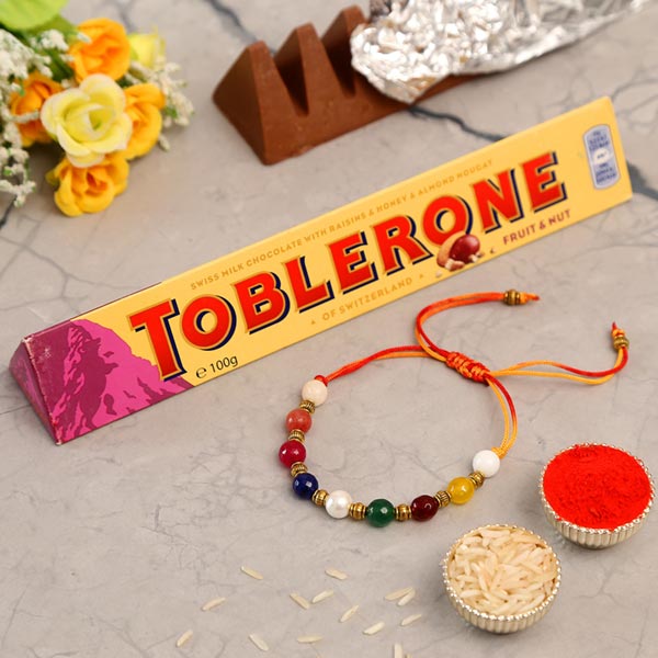 Navrattan Bracelet Pearl Rakhi And Toblerone Chocolate