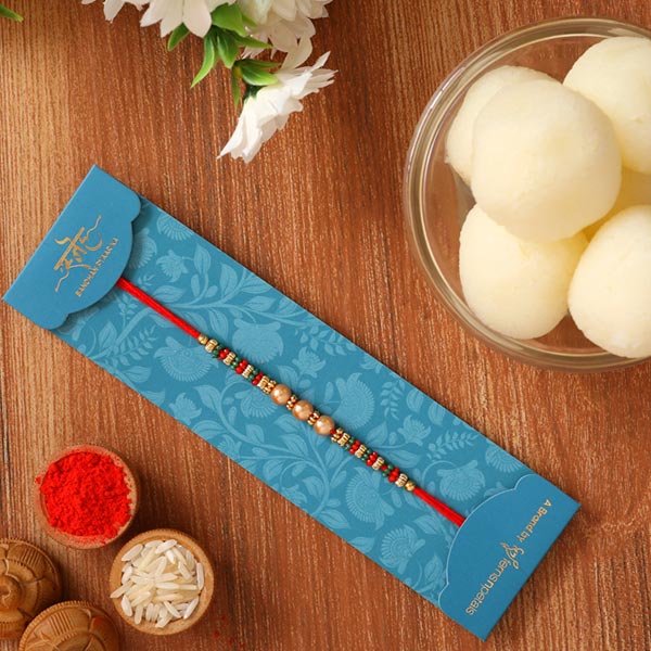 Pearl And Mauli Rakhi With Rasgulla