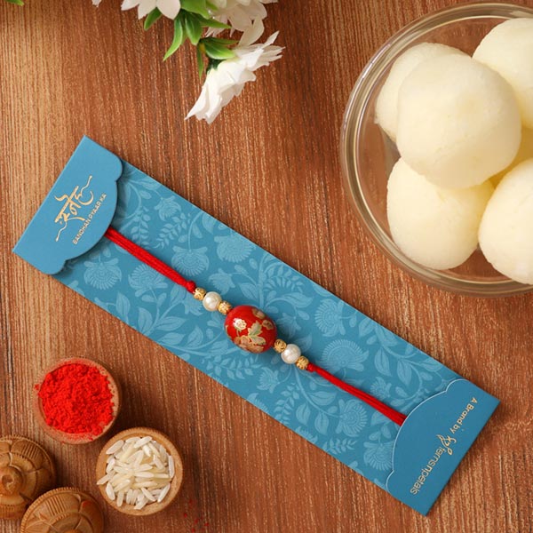 Japanese Red Stone Rakhi And Rasgulla