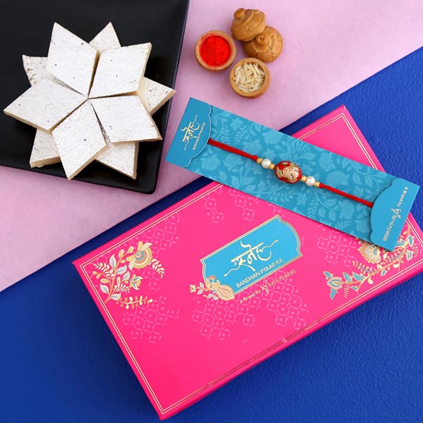 Japanese Red Stone Rakhi And Kaju Katli