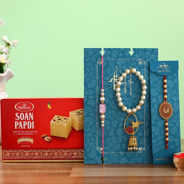 Caged Bird Lumba Rakhi Set & Om Rakhi With Soan Papdi