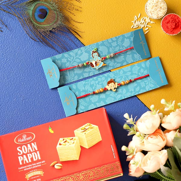 Bal Krishna & Ganesha Face Rakhis With Soan Papdi
