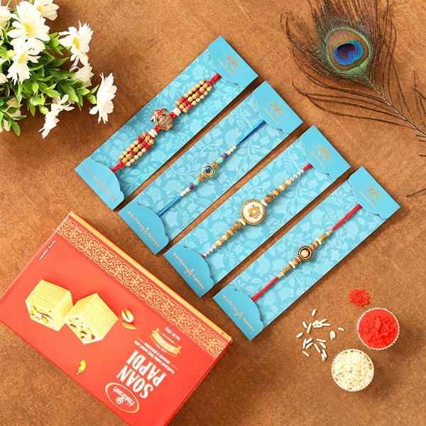 Set Of 4 Designer Rakhis & Soan Papdi Combo