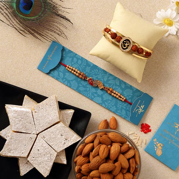 Om Bracelet & Red Peacock Rakhis With Sweets