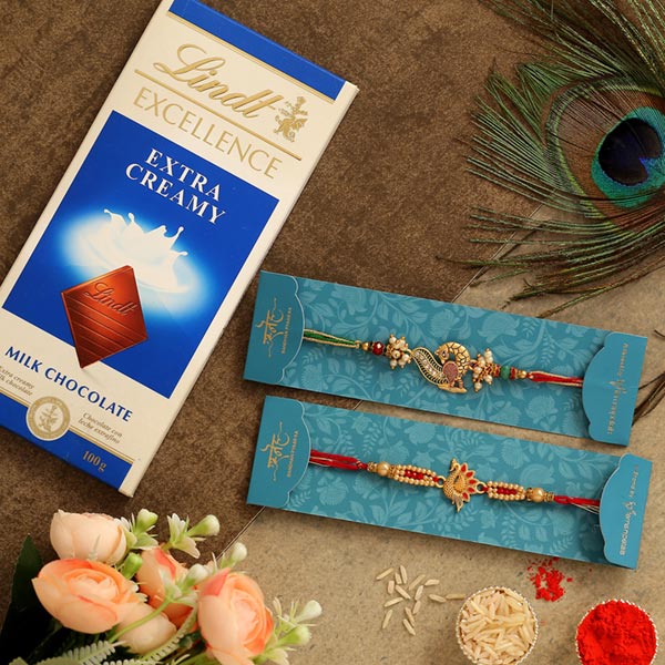 Set Of 2 Peacock Rakhis & Lindt Milk Chocolate