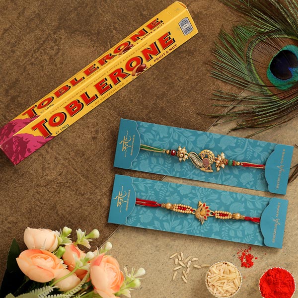 Set Of 2 Peacock Rakhis & Toblerone Chocolate