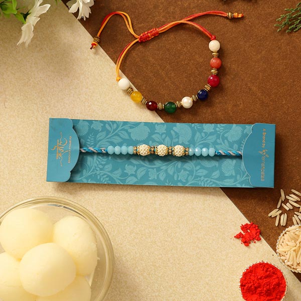 Set Of 2 Ethnic Pearl Rakhis & Rasgulla Tin