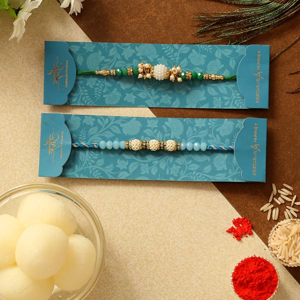 Set Of 2 Pearl Designer Rakhis & Rasgulla Tin