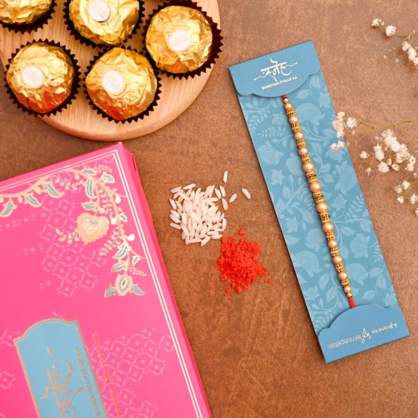Traditional Pearl Mauli Rakhi And 3 Pcs Ferrero Rocher