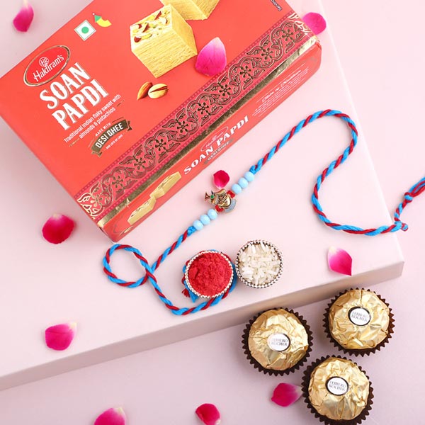 Sneh Blue Krishna Rakhi with 3 Ferrero Rocher and Soan Papdi