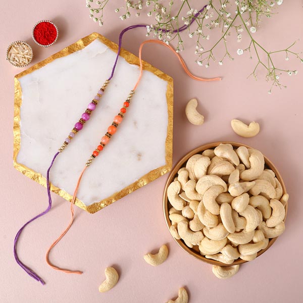Sneh Peachy Rakhi Set with 250 Grams Cashew