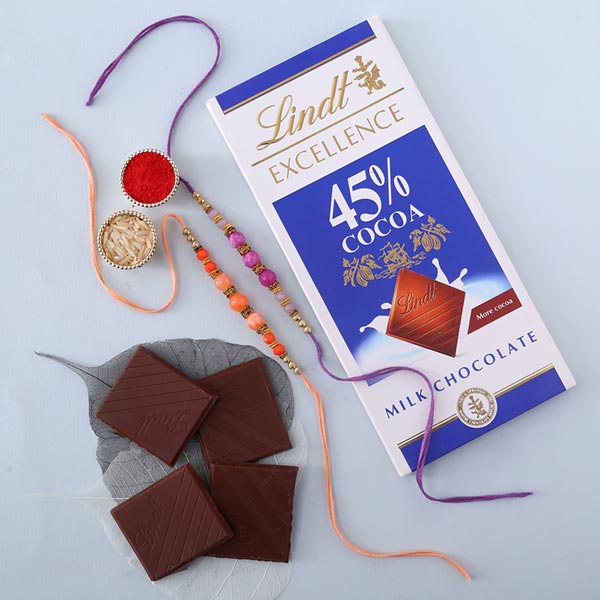 Sneh Peachy Rakhi Set with Lindt Bar Rakhi to Dubai